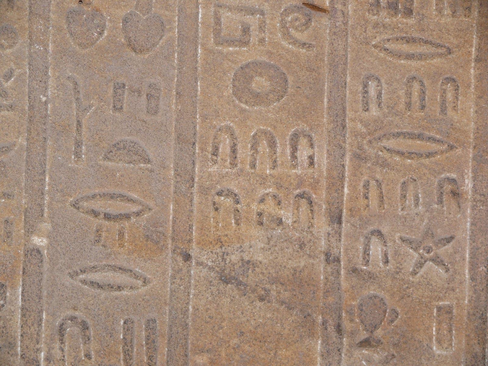 Carved wall at Edfu with rows of Egyptian numeral signs