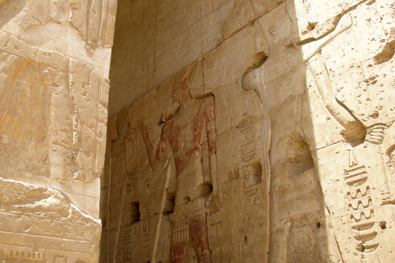 Relief-covered walls with figures and hieroglyph columns in the temple of Seti I at Abydos