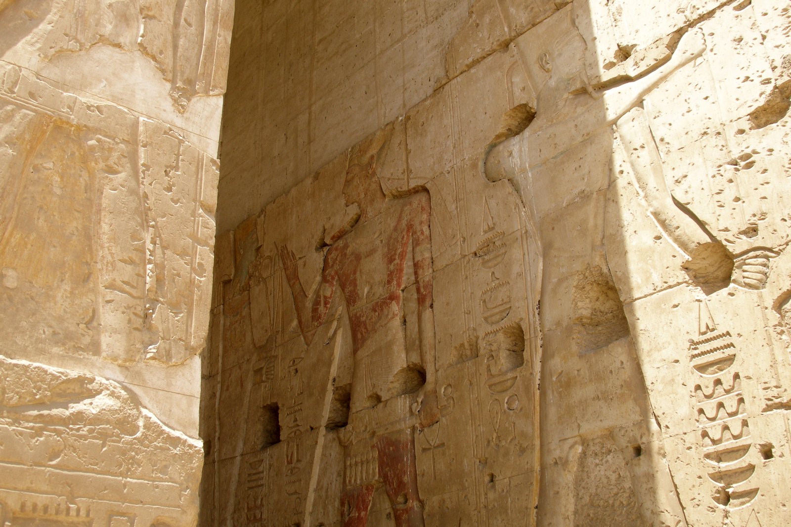 Relief-covered walls with figures and hieroglyph columns in the temple of Seti I at Abydos